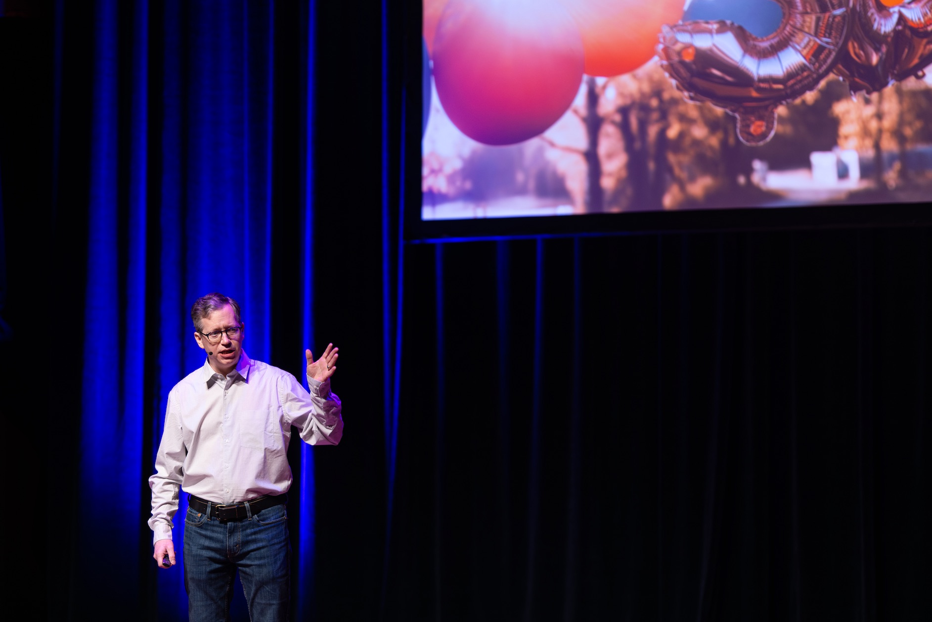 A speaker presenting on stage at Mac Admins Europe 2026
